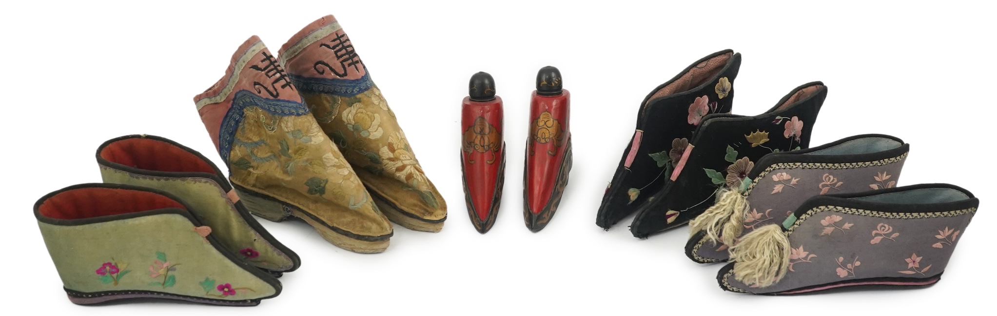 Three pairs of late 19th / early 20th century Chinese ladies embroidered silk shoes, for bound feet, one with sheep’s wool pom-poms, together with a similar a pair of silk embroidered ankle boots and pair of decorative r